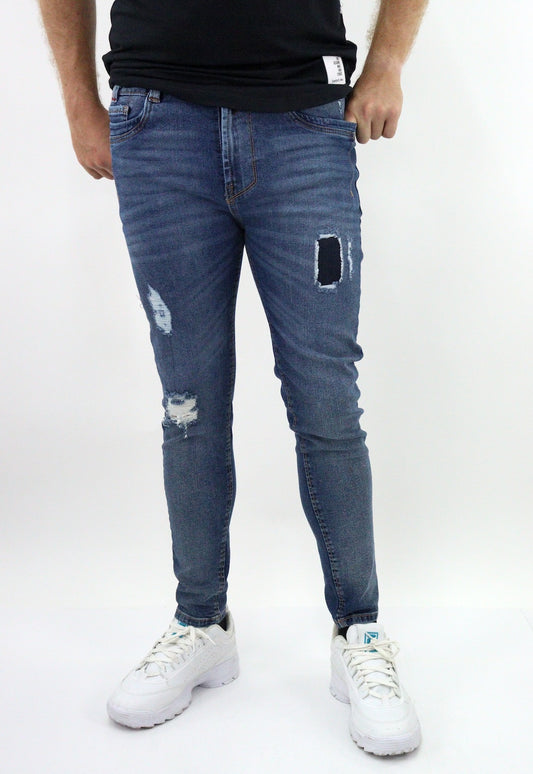Jeans skinny de color azul oscuro con destrucción (NUEVA TEMPORADA)