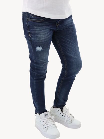 Jeans skinny azul oscuro con destrucción